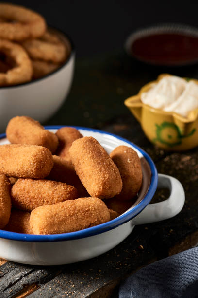 istock spanish croquettes and fried squid rings 1169534831