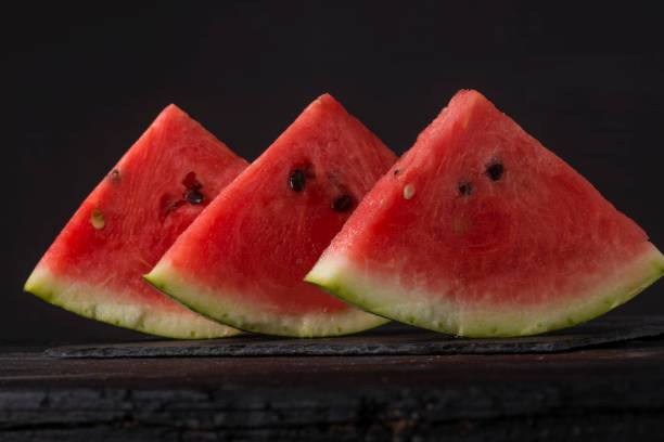 istock fruits and vegetable on black wood table 1169535026