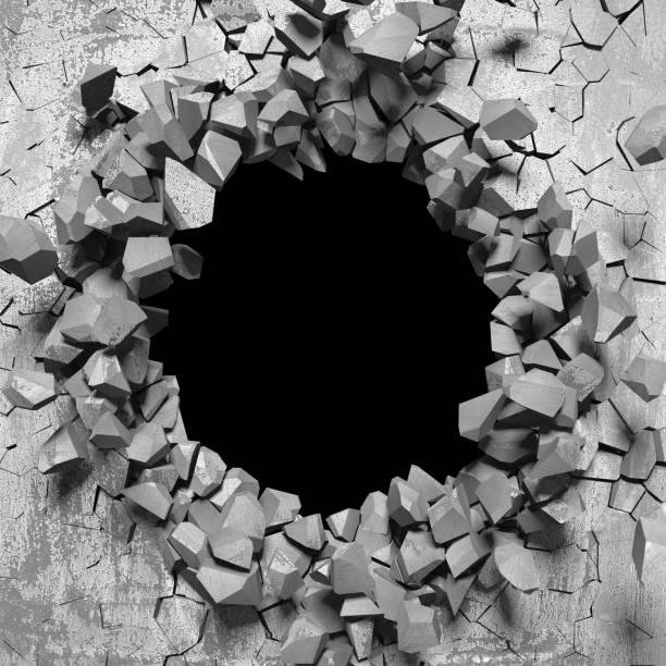 istock Dark cracked broken hole in concrete wall 1169535029
