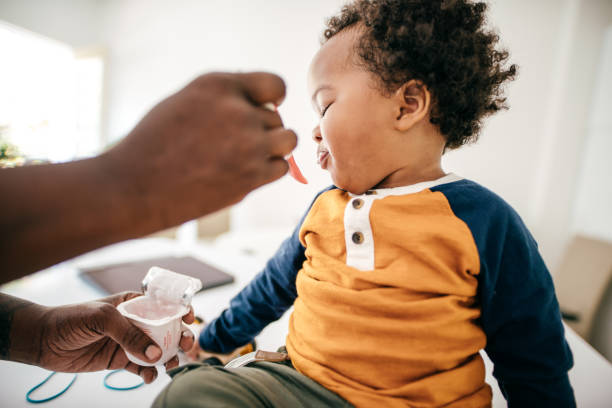 istock Toddler eating yogurt 1169535037