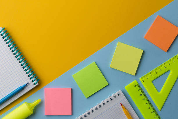istock Notepad and colorful School stationery on colorful background 1169536566
