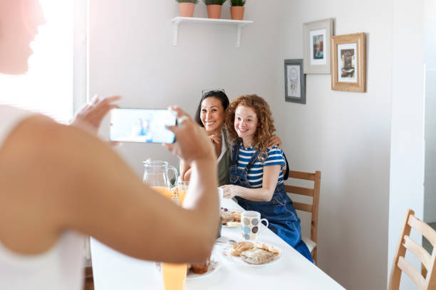 istock Friends Taking Photo With a Smart Phone 1169540575