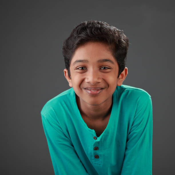 istock Portrait of a happy smiling young boy 1169543237