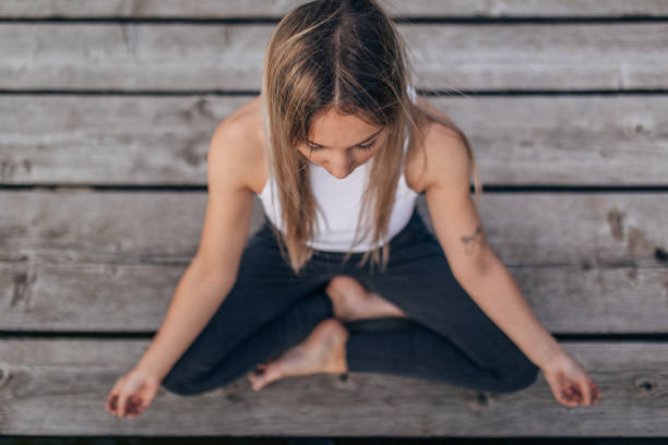 istock Beautiful woman meditating 1169543270