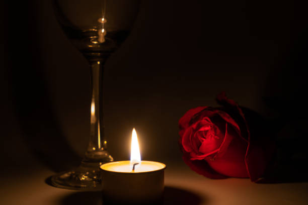 istock Tealight candle, wine glass and rose 1169543315