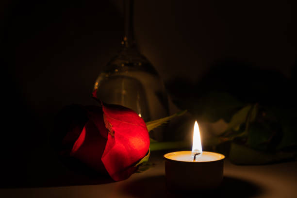 istock Tealight candle, wine glass and rose 1169543343