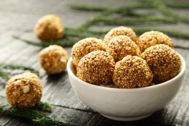 Delicious sesame balls candy. Homemade healthy vegan energy balls, sesame seeds candy with jaggery sesame seed stock pictures, royalty-free photos & images