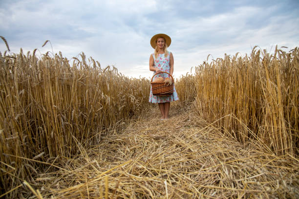 istock Woman holds basket with bread 1169546497
