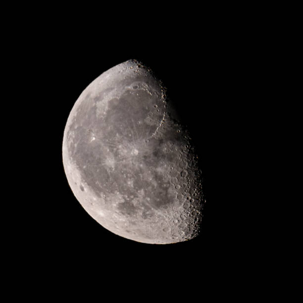 Moon with a clearly visible moon surface in the dark August night sky. The moon is waning from  full moon.