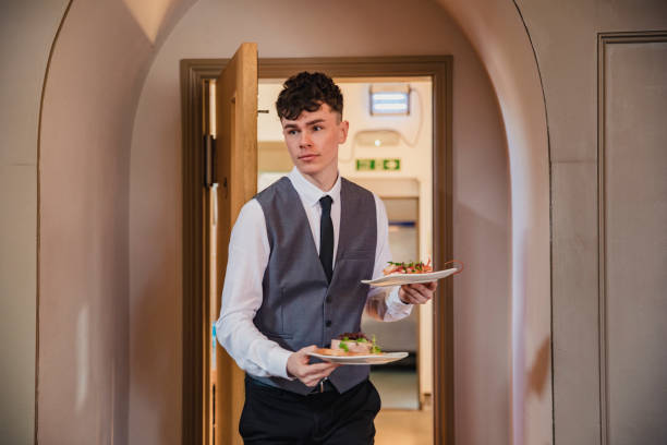 istock Waiter Waiting on Guests 1169547845