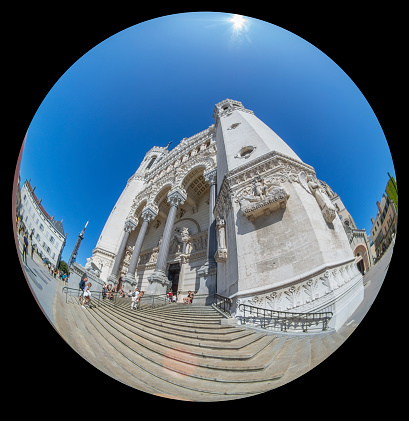 The exterior of the Notre Dame Cathedral, Lyon, France This is taken with a fish-eye lens to include the whole of the facade with the columns going towards the sky.