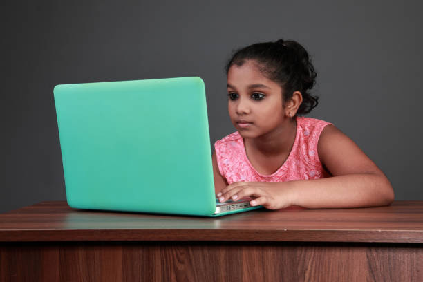 istock little girl using a laptop 1169549084