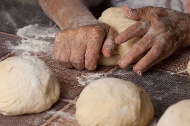 istock Woman making dought.Dought for pizza and bread.Food. 1169549118