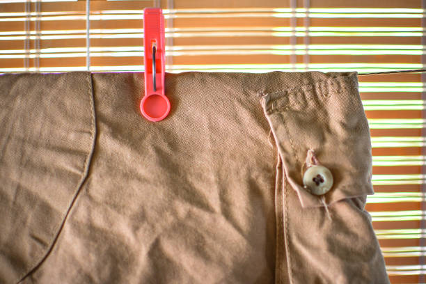 Shorts drying on a wire with a pink clothespin