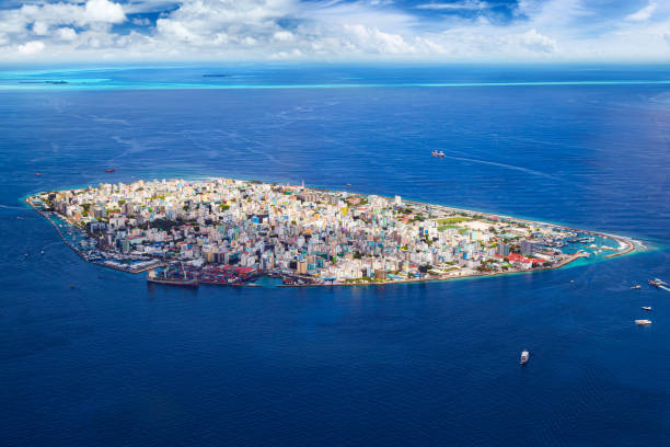 aerial view on male the capital city of maldives. overcrowded island in the indian ocean  blue ocean sea background stock photo