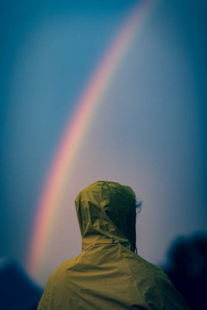 istock Rainy Day Rain Jacket and Rainbows 1169554118