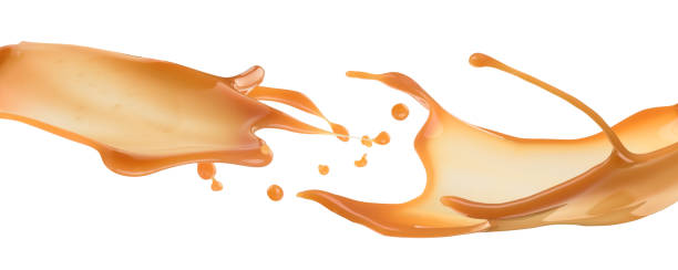 spritzer flüssiges karamell auf weißem hintergrund - foods and drinks simplicity purity image technique stock-fotos und bilder