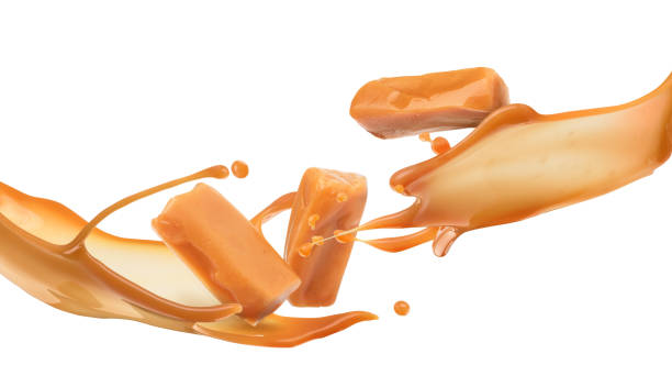 istock Flowing caramel candies and splash 1169555169