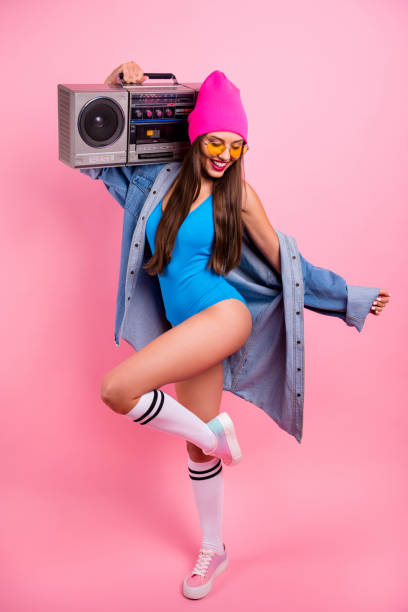 istock Vertical full length body size view of her she nice attractive glamorous graceful thin slender cheerful straight-haired girl posing having fun pleasure carrying boombox isolated over pink background 1169556685
