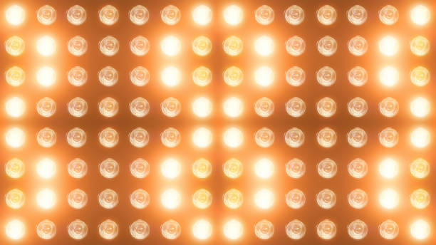 istock 3D rendering of a wall with flashing lights and bright spotlights 1169557205