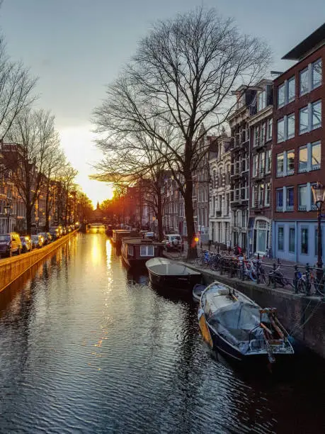 Photo of Winter sunset on the Amsterdam canal with reflection