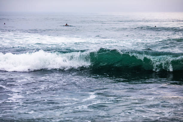 istock Ocean blue wave in ocean. Breaking wave for surfing in Bali 1169558482