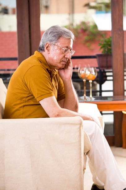 istock Thoughtful senior man at home 1169558912