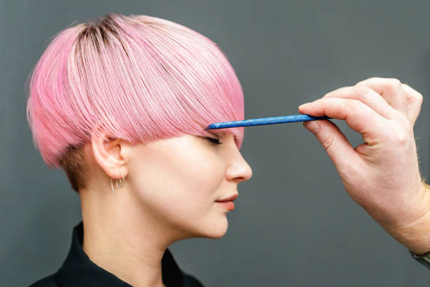 Professional Hairdresser Combing With A Comb Short Pink Hair Stock Photo -  Download Image Now - iStock