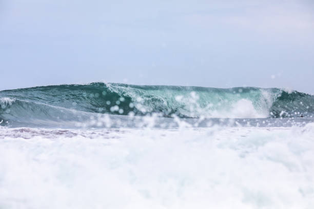 istock Ocean blue wave in ocean. Breaking wave for surfing in Bali 1169558959