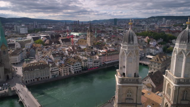 Zurich Grossmünster to Saint Peter church traveling - Aerial 4K