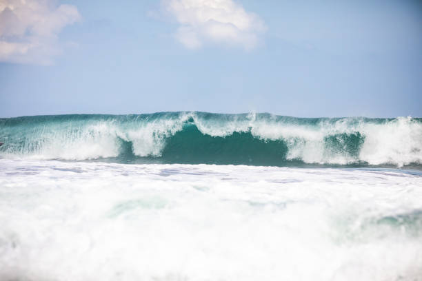 istock Ocean blue wave in ocean. Breaking wave for surfing in Bali 1169560267