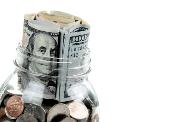 istock US bank note in a jar isolated on white background 1169563589