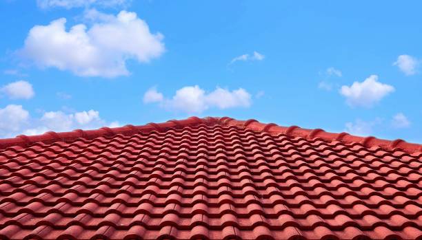 istock Red tile roof with blue sky 1169564733