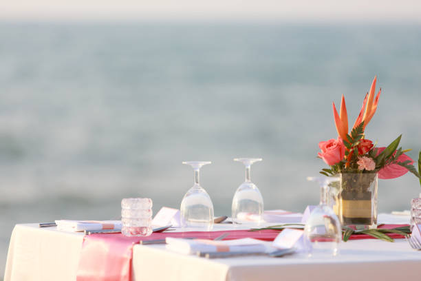 istock Wedding table set up on the beach. Wedding the tropical theme outdoor dinner table on beach Pattaya Thailand. Impressive and beautiful wedding set up outdoor on the beach. 1169566114