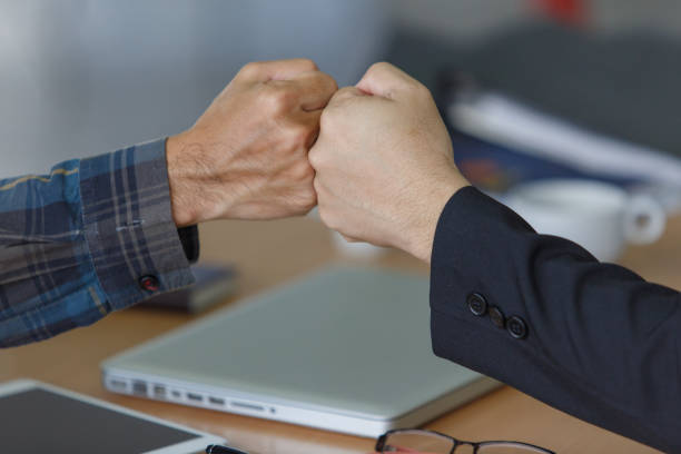 istock Business people join hand together during their meeting teamwork concepts 1169566220