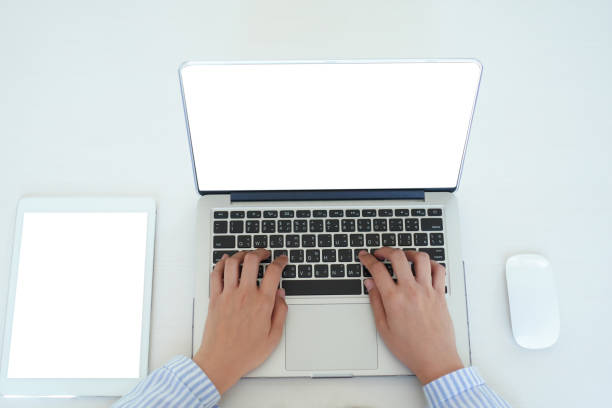 istock Freelancing woman using laptop computer for distance job while sitting in coffee shop. Business woman typing on laptop at workplace Woman working in home office hand keyboard. 1169566286