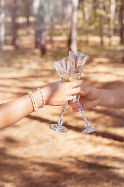 istock Wedding glasses with champagne in couple's hands. 1169568644