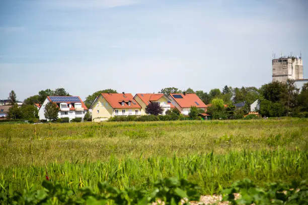 Housing estate in the countryside, modern urbanization, sunflower field