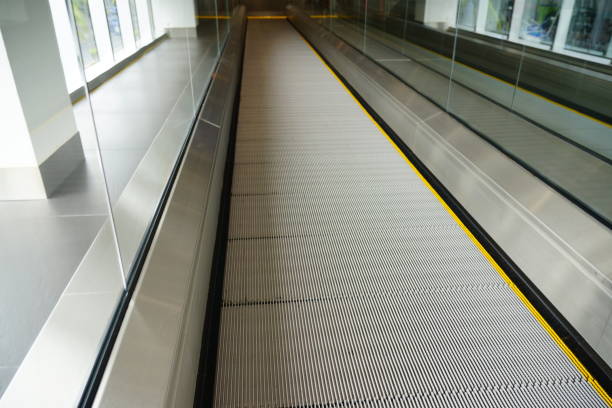 istock Moving escalator in modern building 1169572319