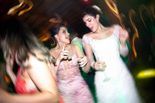 bride and wedding guest dancing during wedding receptio - life events laughing women latin american and hispanic ethnicity imagens e fotografias de stock