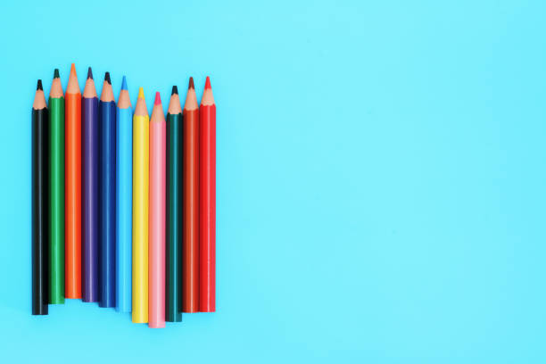 istock Colored pencils. A set colored pencils isolated on a blue background. 1169578490