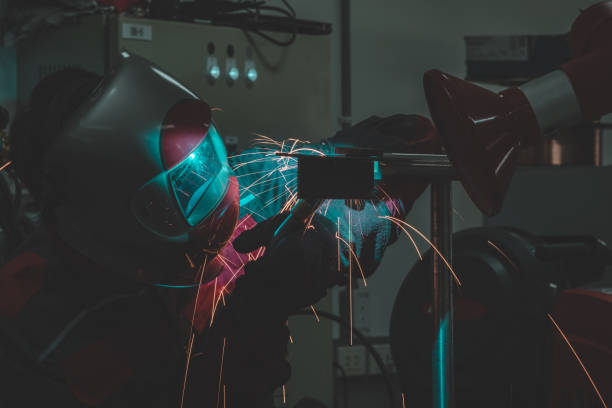 istock Worker welding working in the factory 1169584244
