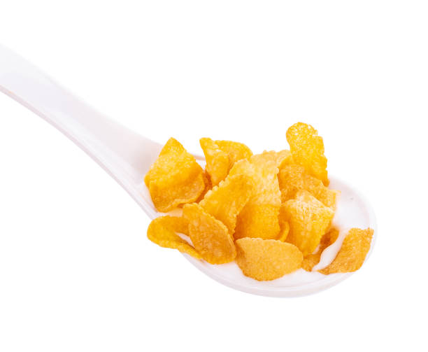 istock Corn flakes in spoon isolated on white background 1169584769