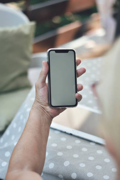 istock Mature woman using tablet and smarthphone 1169586736