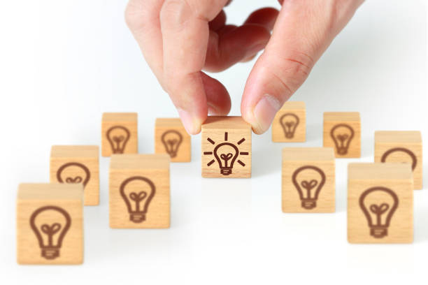 istock Concept creative idea and innovation.  wooden cube block  in hand 1169588144