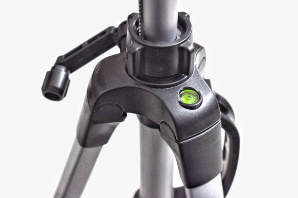 istock Adjustable tripod stand photography equipment background 1169590340