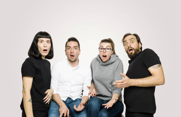 istock Large diverse group of people shocked looking at camera 1169595873