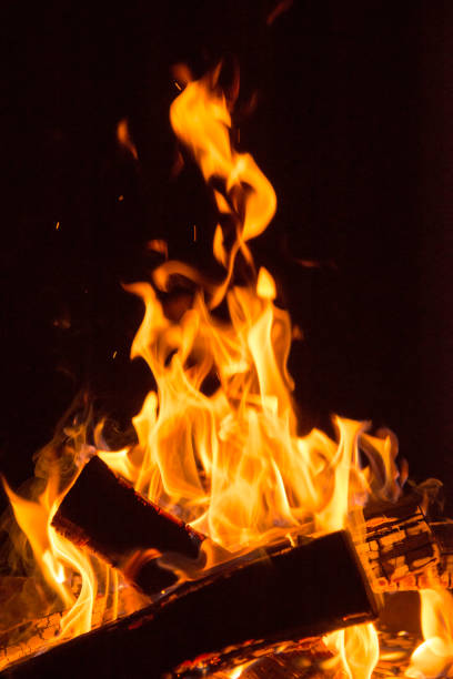Flaming bonfire and embers.