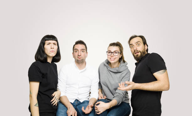 istock Large diverse group of people shocked looking at camera 1169596670