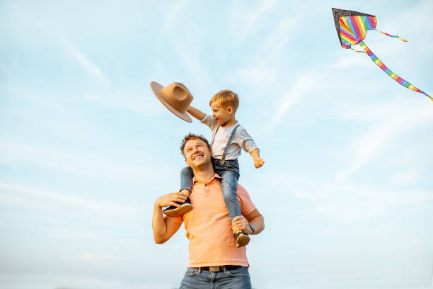 istock Father with son having fun outdoors 1169598310